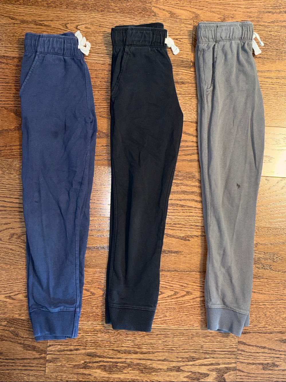Boys size 8 bundle of 3 pairs of Carter’s sweatpants. Navy, black, gray.